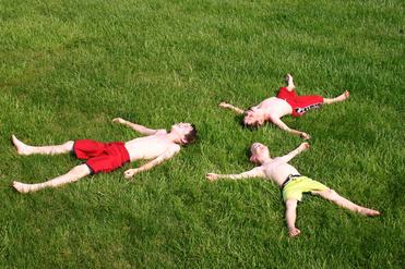 boys having fun in the grass